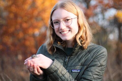 Emma holding a Gray Catbird