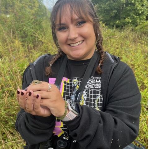 Veronica holding a warbler